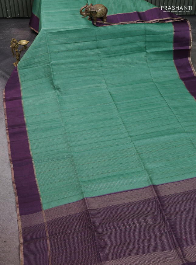Semi tussar saree teal green and deep purple with allover zari weaves and rettapet zari woven border