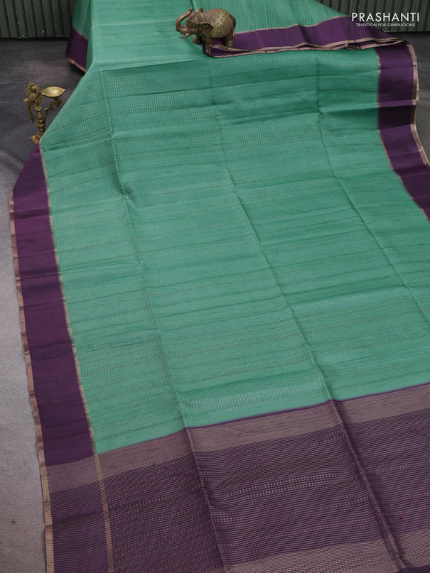 Semi tussar saree teal green and deep purple with allover zari weaves and rettapet zari woven border