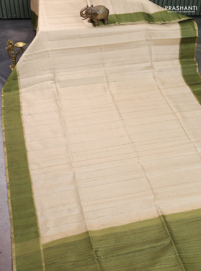 Semi tussar saree beige and light green with allover zari weaves and rettapet zari woven border