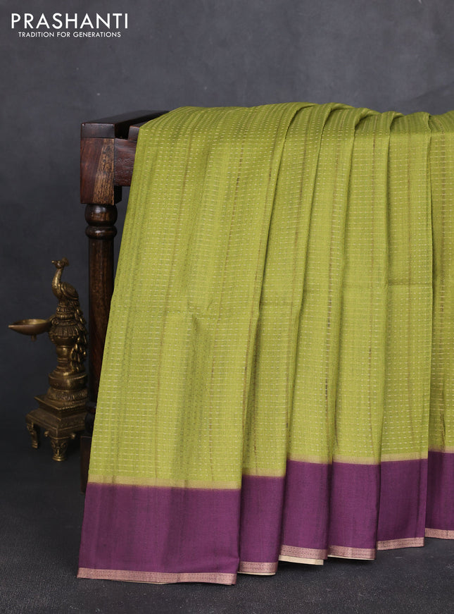 Semi tussar saree light green and purple with allover zari weaves and rettapet zari woven border
