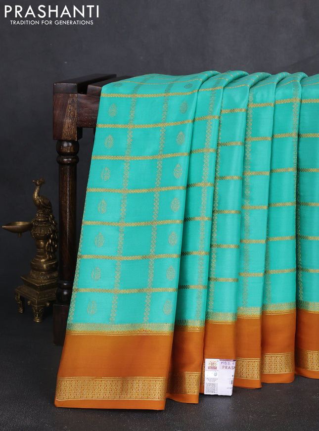Pure mysore silk saree teal green shade and dark mustard with allover zari checks & buttas and rettapet zari woven border