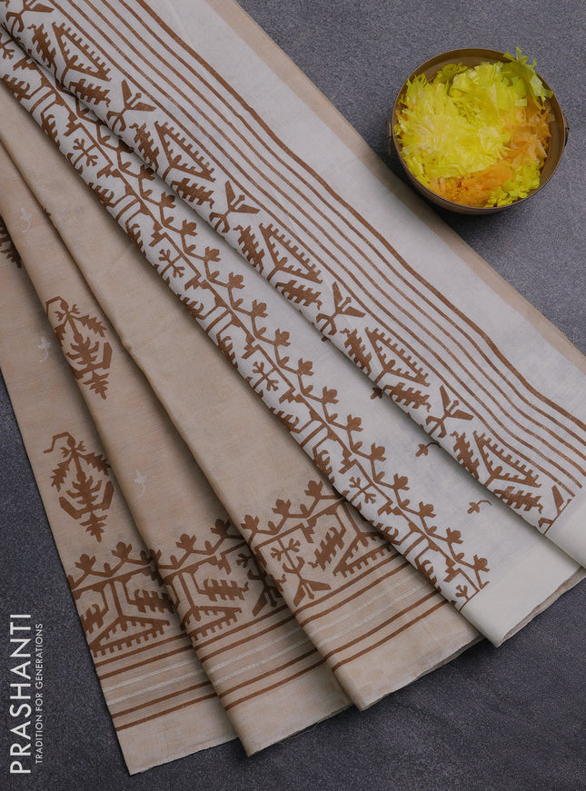 Chirala cotton saree sandal and cream with allover self emboss & butta prints and printed zari border