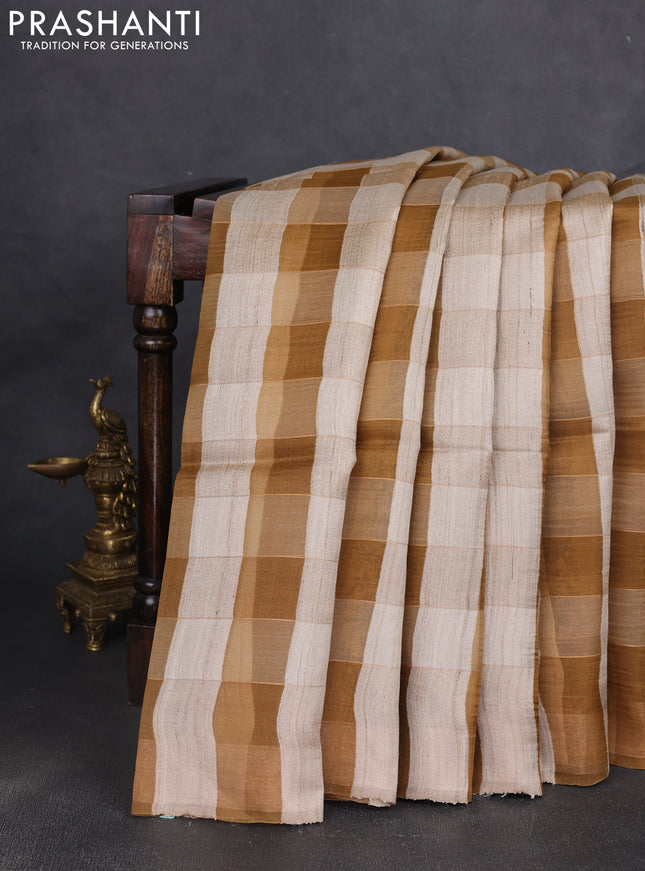 Pure dupion silk saree beige mustard yellow and dark sandal with allover zari woven checked pattern and concept printed pallu