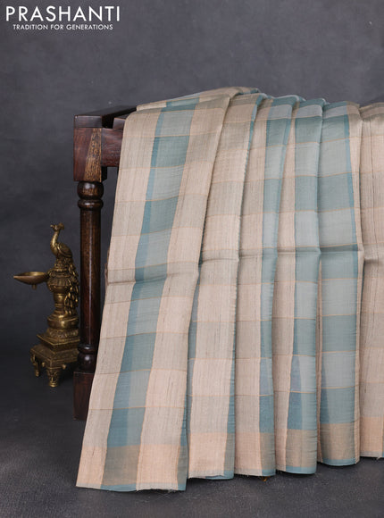 Pure dupion silk saree pastel blue beige and pastel blue with allover zari woven checked pattern and printed pallu
