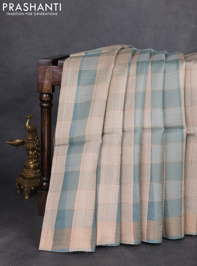 Pure dupion silk saree pastel blue beige and pastel blue with allover zari woven checked pattern and printed pallu