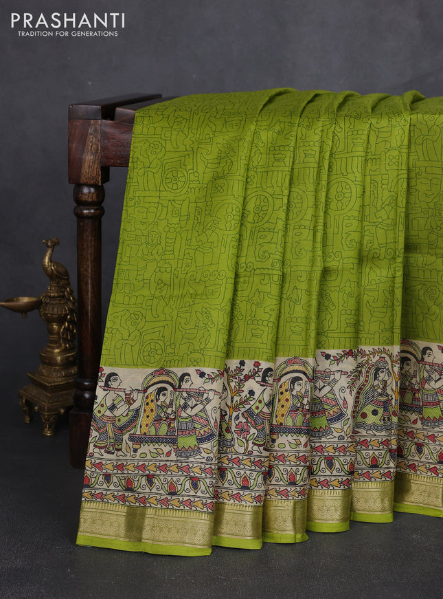 Pure printed silk saree light green with allover prints and madhubani printed zari woven border