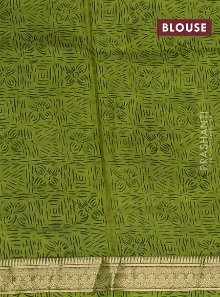 Pure printed silk saree light green with allover prints and madhubani printed zari woven border