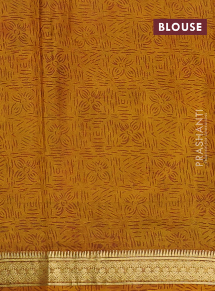 Pure printed silk saree mustard yellow with allover prints and madhubani printed zari woven border