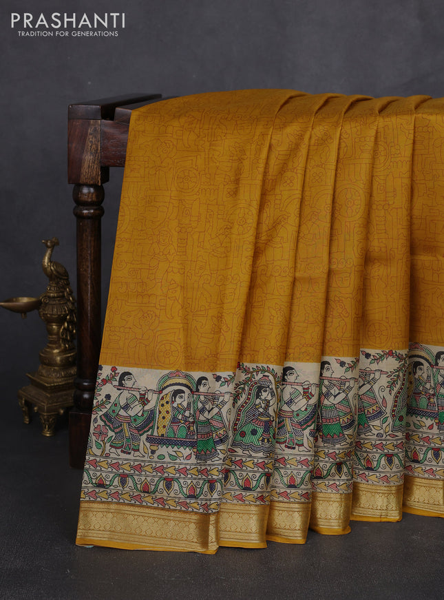 Pure printed silk saree mustard yellow with allover prints and madhubani printed zari woven border