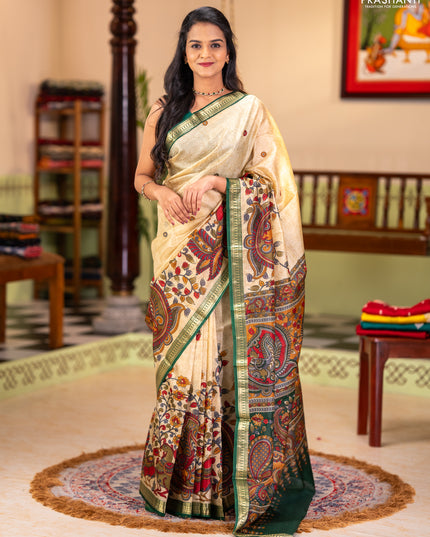 Pure printed silk saree beige and green with allover kalamkari prints and zari woven border