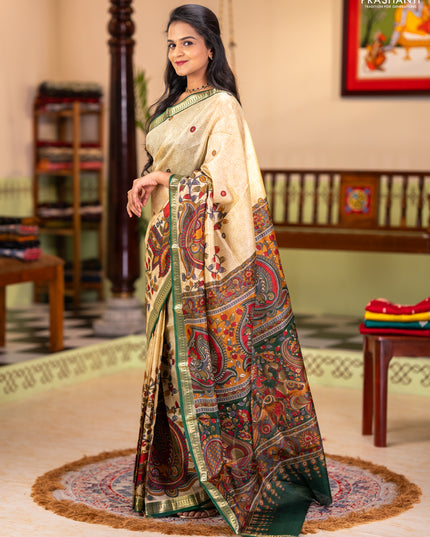 Pure printed silk saree beige and green with allover kalamkari prints and zari woven border