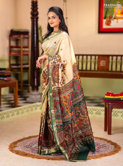 Pure printed silk saree beige and green with allover kalamkari prints and zari woven border