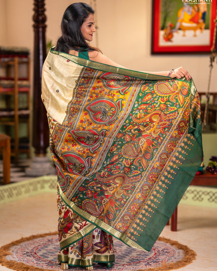 Pure printed silk saree beige and green with allover kalamkari prints and zari woven border