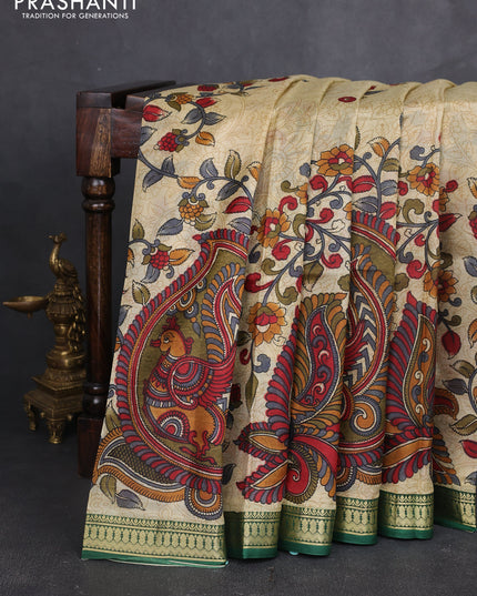 Pure printed silk saree beige and green with allover kalamkari prints and zari woven border