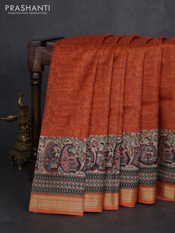 Pure printed silk saree orange with allover prints and madhubani printed zari woven border