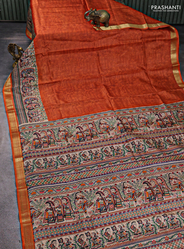 Pure printed silk saree orange with allover prints and madhubani printed zari woven border