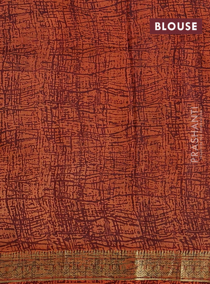 Pure printed silk saree orange with allover prints and madhubani printed zari woven border