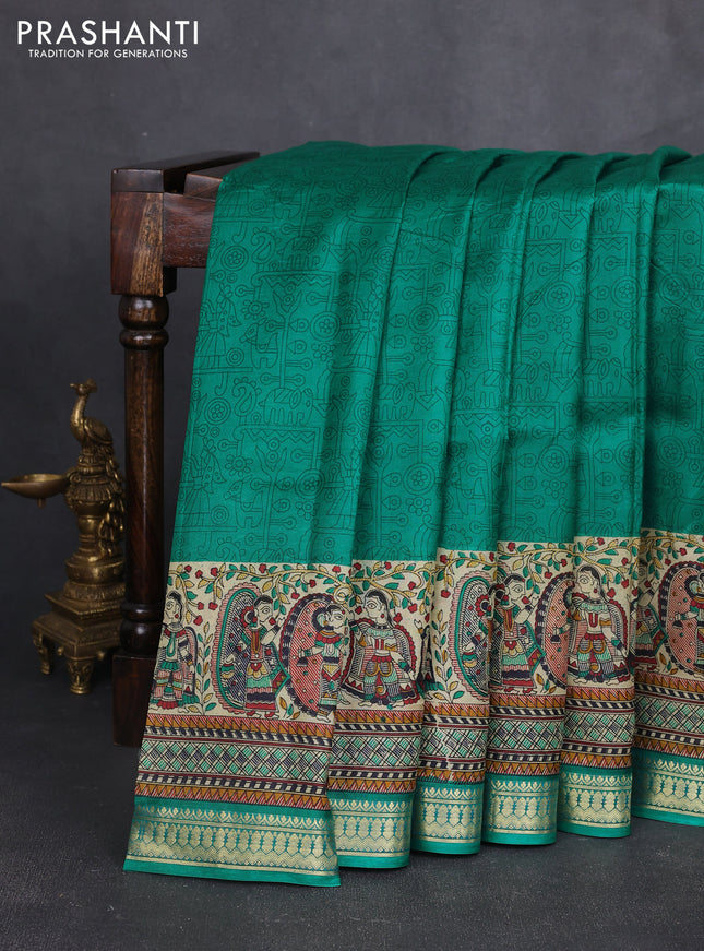 Pure printed silk saree teal green with allover prints and madhubani printed zari woven border