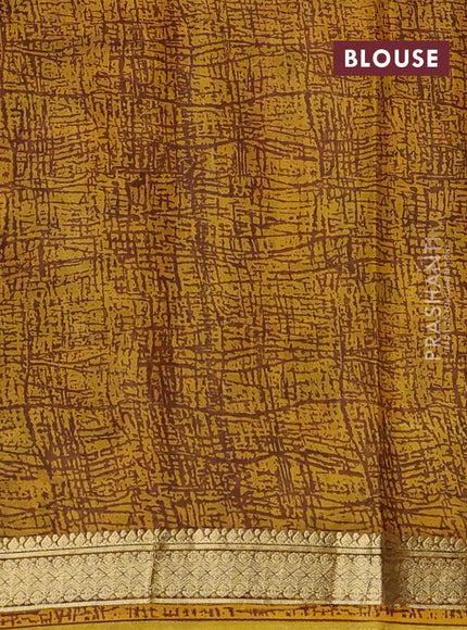 Pure printed silk saree mustard yellow with allover prints and madhubani printed zari woven border