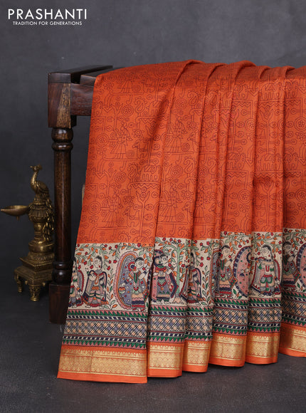 Pure printed silk saree orange with allover prints and madhubani printed zari woven border