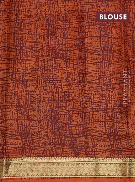 Pure printed silk saree orange with allover prints and madhubani printed zari woven border