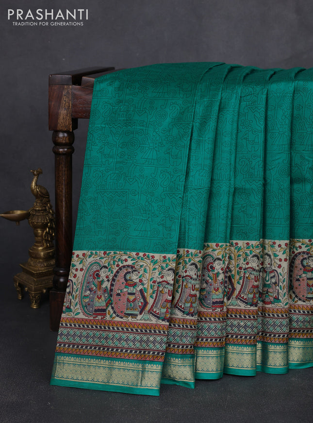 Pure printed silk saree teal green with allover prints and madhubani printed zari woven border