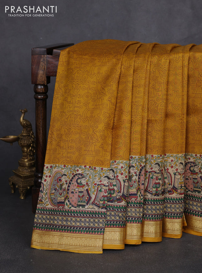 Pure printed silk saree mustard yellow with allover prints and madhubani printed zari woven border