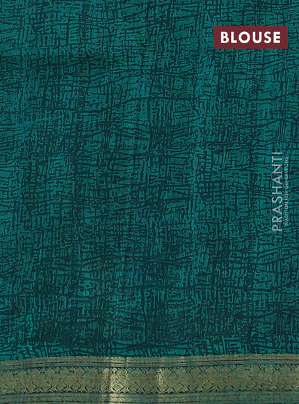 Pure printed silk saree teal green with allover prints and madhubani printed zari woven border