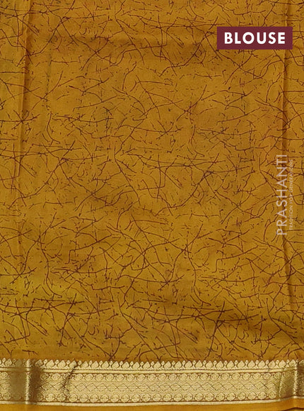Pure printed silk saree mustard yellow with allover prints and madhubani printed zari woven border