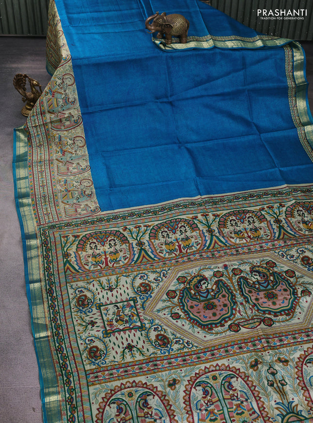 Pure printed silk saree cs blue with allover prints and madhubani printed zari woven border