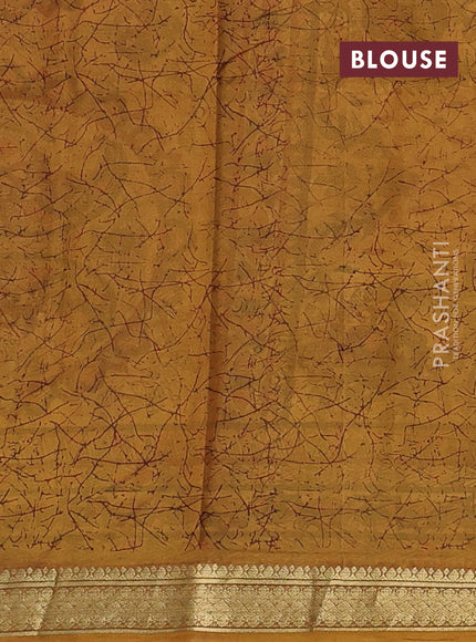 Pure printed silk saree mustard yellow with allover prints and madhubani printed zari woven border