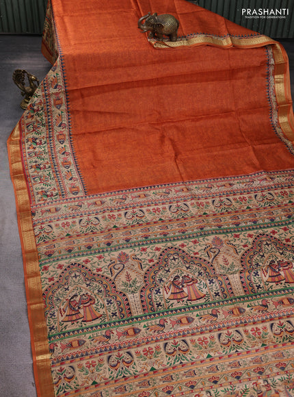 Pure printed silk saree orange with allover prints and madhubani printed zari woven border