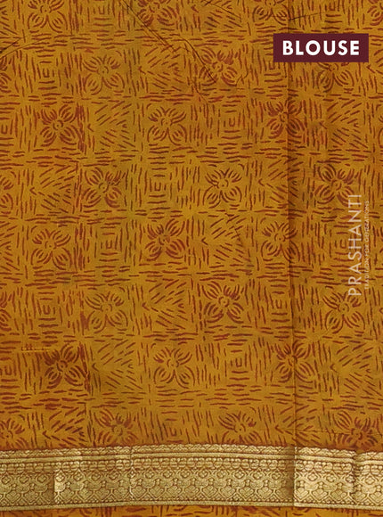 Pure printed silk saree mustard yellow with allover prints and madhubani printed zari woven border