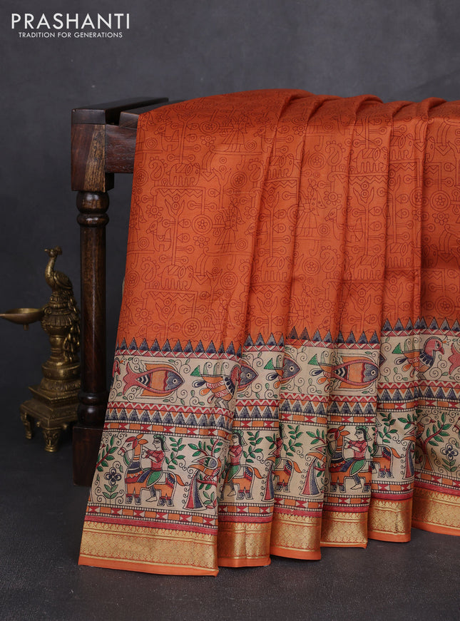 Pure printed silk saree orange with allover prints and madhubani printed zari woven border