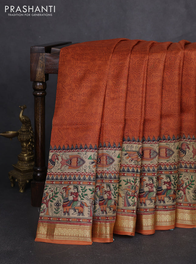 Pure printed silk saree orange with allover prints and madhubani printed zari woven border