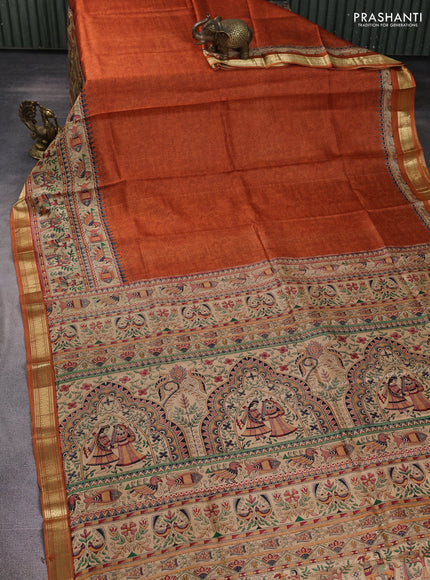Pure printed silk saree orange with allover prints and madhubani printed zari woven border