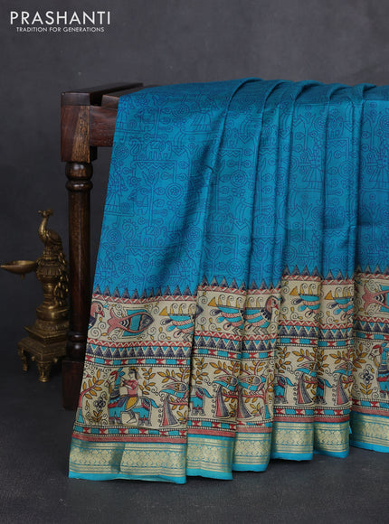 Pure printed silk saree teal blue with allover prints and madhubani printed zari woven border