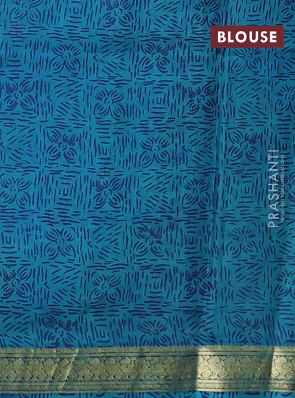 Pure printed silk saree teal blue with allover prints and madhubani printed zari woven border