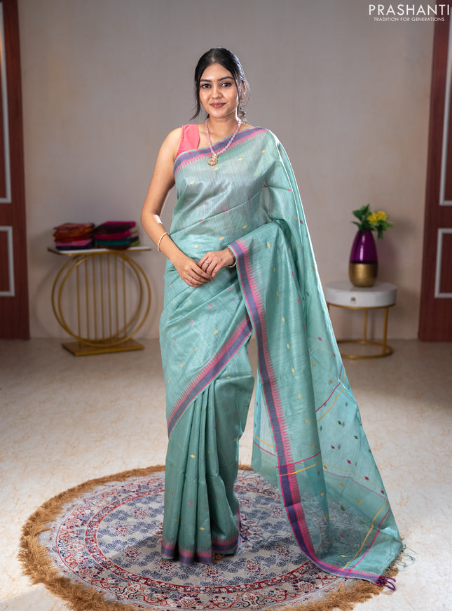 Munga tussar silk saree pastel green shade and pink with thread woven geomatric buttas and organza pallu
