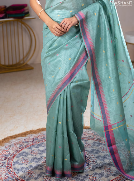 Munga tussar silk saree pastel green shade and pink with thread woven geomatric buttas and organza pallu
