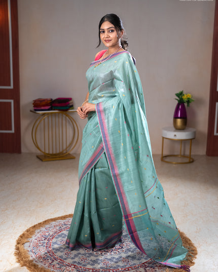 Munga tussar silk saree pastel green shade and pink with thread woven geomatric buttas and organza pallu