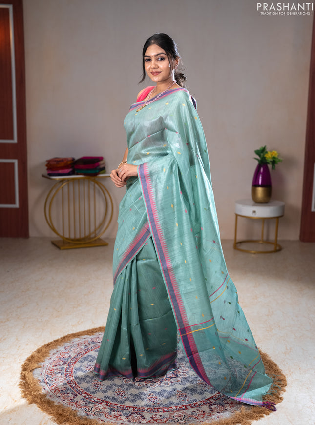Munga tussar silk saree pastel green shade and pink with thread woven geomatric buttas and organza pallu