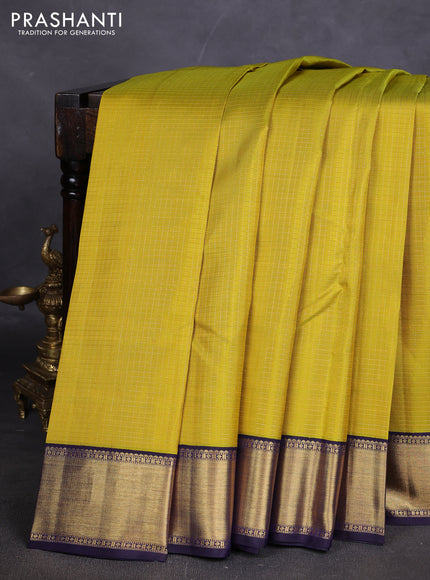 Pure kanchipuram silk saree lime yellow and dark blue with allover small zari woven checked pattern and rich zari woven border