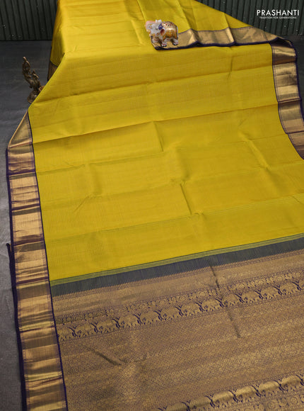 Pure kanchipuram silk saree lime yellow and dark blue with allover small zari woven checked pattern and rich zari woven border