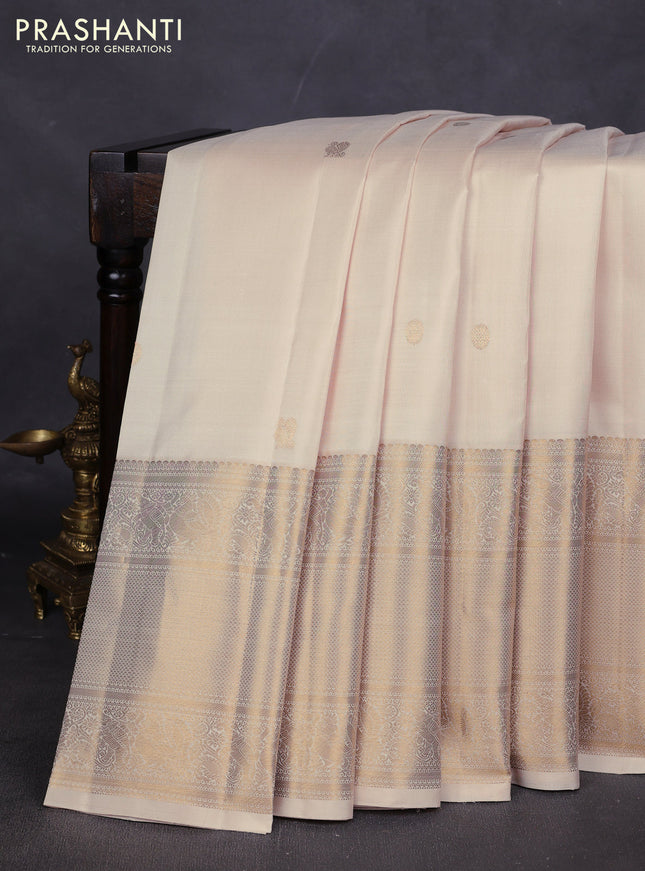 Pure kanchipuram silk saree cream with annam & rudhraksha zari woven buttas and long zari woven border