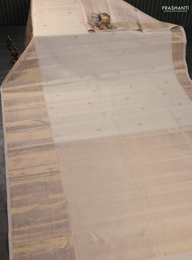 Pure kanchipuram silk saree cream with annam & rudhraksha zari woven buttas and long zari woven border