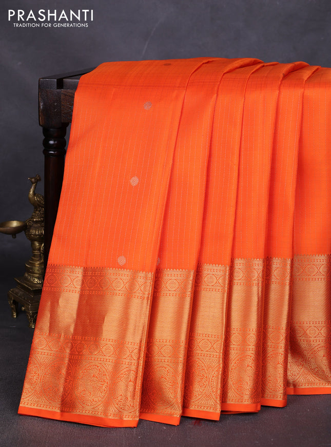 Pure kanchipuram silk saree orange with allover zari stripes & buttas and long rich zari woven border