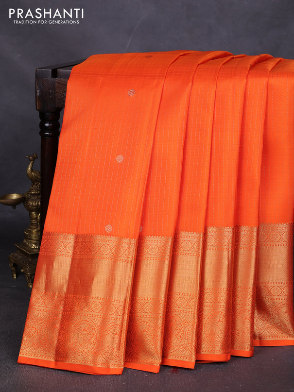 Pure kanchipuram silk saree orange with allover zari stripes & buttas and long rich zari woven border