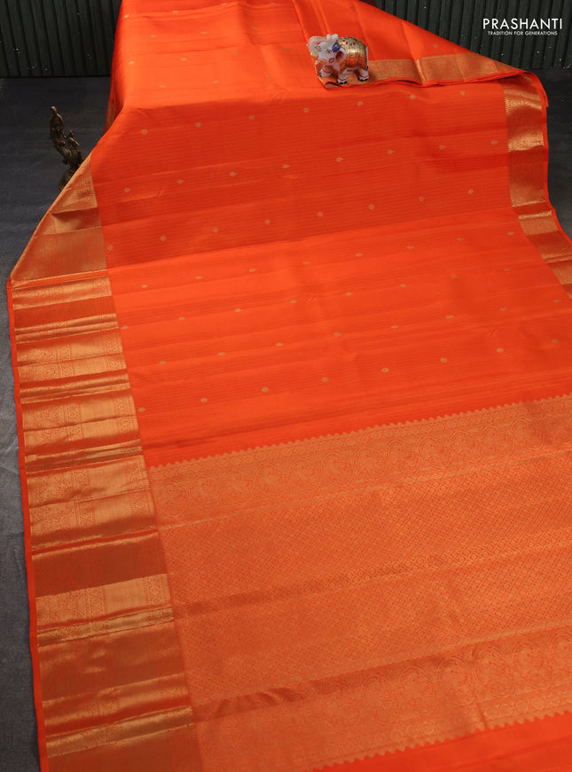 Pure kanchipuram silk saree orange with allover zari stripes & buttas and long rich zari woven border