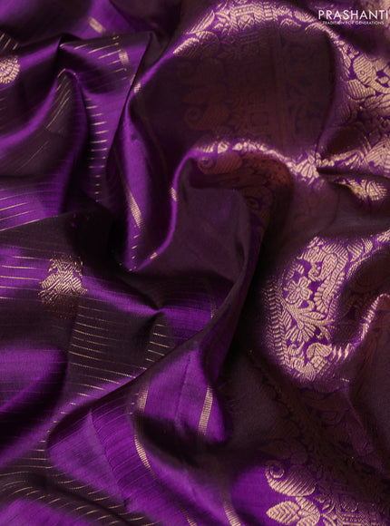 Pure kanchipuram silk saree violet with allover zari stripes & buttas and rich zari woven border